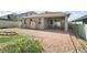 Backyard featuring a brick paver patio, fire pit area, well-maintained landscaping, and storage shed, perfect for relaxation at 3139 Hurston Watch Ln, Clermont, FL 34711