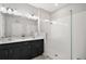 Bathroom featuring a double vanity with a framed glass shower at 3139 Hurston Watch Ln, Clermont, FL 34711