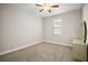 Bedroom featuring neutral carpet, bright window, and dresser at 3139 Hurston Watch Ln, Clermont, FL 34711