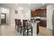 Eat-in kitchen with granite countertops, stainless steel appliances, and bar seating at 3139 Hurston Watch Ln, Clermont, FL 34711