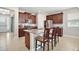 Kitchen with a granite island, stainless steel appliances, and stylish wood cabinetry at 3139 Hurston Watch Ln, Clermont, FL 34711