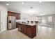 Open-concept kitchen featuring a large island, stainless steel appliances and an open design at 3139 Hurston Watch Ln, Clermont, FL 34711