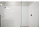 Frameless glass shower with white subway tiles at 3139 Hurston Watch Ln, Clermont, FL 34711