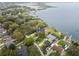 Beautiful aerial view of waterfront properties with mature trees and scenic lake views at 31400 Saunders Dr, Tavares, FL 32778