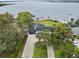 Aerial shot of the home featuring a large backyard and lake access at 31400 Saunders Dr, Tavares, FL 32778
