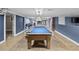 Finished basement featuring a pool table, neutral paint and tile floors at 31400 Saunders Dr, Tavares, FL 32778