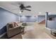 Finished basement with a large sofa, recessed lights, and tile floors at 31400 Saunders Dr, Tavares, FL 32778