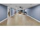 Spacious finished basement with tile flooring, neutral walls and modern lighting at 31400 Saunders Dr, Tavares, FL 32778