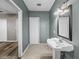 Bathroom with a pedestal sink and access to the rest of the home at 31400 Saunders Dr, Tavares, FL 32778
