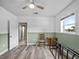 Bedroom featuring wood-look floors and ample natural light at 31400 Saunders Dr, Tavares, FL 32778