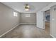 Bedroom featuring tile floors, light paint, and a ceiling fan at 31400 Saunders Dr, Tavares, FL 32778