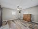 Bedroom with wood-look floors and a wooden dresser at 31400 Saunders Dr, Tavares, FL 32778