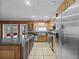 Modern kitchen featuring stainless steel appliances, bright cabinets, and a convenient island at 31400 Saunders Dr, Tavares, FL 32778