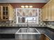 Gourmet kitchen sink with a view of the water at 31400 Saunders Dr, Tavares, FL 32778