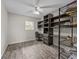 Office with built-in shelving and wood-look floors at 31400 Saunders Dr, Tavares, FL 32778