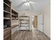 View of the office with shelving and access to kitchen at 31400 Saunders Dr, Tavares, FL 32778
