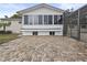 Spacious outdoor brick patio connected to the enclosed sunroom at 31400 Saunders Dr, Tavares, FL 32778