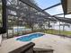 Backyard pool with screen enclosure and lake views at 31400 Saunders Dr, Tavares, FL 32778