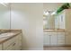 Bright bathroom with dual vanities, cabinets, drawers, and neutral decor at 3144 Mayflower Loop, The Villages, FL 32163