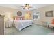 Spacious main bedroom offering a ceiling fan, neutral décor, and ample natural light with cozy accents and furnishings at 3349 Ashbrook Pl, The Villages, FL 32162