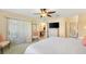 Serene main bedroom featuring neutral colors, ample natural light, and a ceiling fan, creating a relaxing retreat at 3349 Ashbrook Pl, The Villages, FL 32162