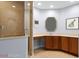 Bathroom with tile floors, a glass-enclosed shower, and a vanity with ample counter space at 3430 Turningwind Ln, Winter Garden, FL 34787