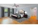 Comfortable bedroom with ceiling fan, natural light, and neutral decor at 3430 Turningwind Ln, Winter Garden, FL 34787
