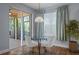 Cozy dining nook with backyard access, natural light, and seating for two at 3430 Turningwind Ln, Winter Garden, FL 34787