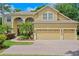 Charming two-story home featuring a well-manicured lawn and three-car garage at 3430 Turningwind Ln, Winter Garden, FL 34787