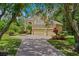 Beautiful home showcasing a well-maintained yard, a three-car garage, and an inviting driveway at 3430 Turningwind Ln, Winter Garden, FL 34787