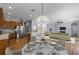Open-concept living area with stainless steel appliances and seamless flow to the living room at 3430 Turningwind Ln, Winter Garden, FL 34787