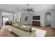 Spacious living room with hardwood floors, ceiling fan, and comfortable seating arrangement at 3430 Turningwind Ln, Winter Garden, FL 34787