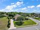 Aerial view of the home with mature trees and lush landscaping at 39100 Tacoma Dr, Lady Lake, FL 32159