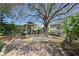 Beautiful backyard featuring a brick patio, gazebo and garden at 39100 Tacoma Dr, Lady Lake, FL 32159