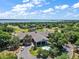 Aerial view of community clubhouse with water feature surrounded by trees at 39100 Tacoma Dr, Lady Lake, FL 32159