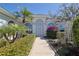 Inviting home exterior with manicured front yard and a charming walkway leading to the front door at 39100 Tacoma Dr, Lady Lake, FL 32159