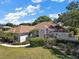 Charming single story home with well-manicured landscaping and a welcoming facade at 39100 Tacoma Dr, Lady Lake, FL 32159