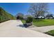 Charming home with a well-manicured front yard, lush landscaping, and a private driveway at 39100 Tacoma Dr, Lady Lake, FL 32159
