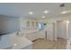 Bright kitchen with white cabinetry, quartz countertops, and stainless steel appliances at 39100 Tacoma Dr, Lady Lake, FL 32159