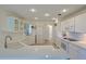 Modern kitchen featuring white cabinetry, quartz countertops, and stainless steel appliances at 39100 Tacoma Dr, Lady Lake, FL 32159