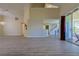 Spacious living area with stylish flooring, an open layout, and sliding glass doors at 39100 Tacoma Dr, Lady Lake, FL 32159