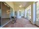 Screened lanai featuring tile flooring, a ceiling fan, and views of the backyard at 39100 Tacoma Dr, Lady Lake, FL 32159