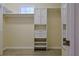 Walk-in closet with installed shelving, drawers and rods providing ample storage space at 39100 Tacoma Dr, Lady Lake, FL 32159
