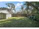 Spacious backyard area with a wooden fence, offering privacy and room for outdoor activities at 40619 W 3Rd Ave, Umatilla, FL 32784