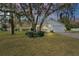 Charming single-story home with a well-maintained lawn and mature landscaping at 40619 W 3Rd Ave, Umatilla, FL 32784