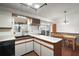 Well-lit kitchen featuring a dining area and ample counter space at 40619 W 3Rd Ave, Umatilla, FL 32784