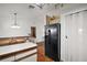 Bright kitchen featuring hardwood flooring and appliances at 40619 W 3Rd Ave, Umatilla, FL 32784