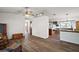 Open concept living area with wood floors and lots of natural light at 40619 W 3Rd Ave, Umatilla, FL 32784