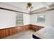 Bright office space featuring wood trim and laminate floors, offering a simple yet functional design at 40619 W 3Rd Ave, Umatilla, FL 32784