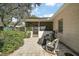 The outdoor patio area features paved flooring and a screened-in porch for relaxing and entertaining at 40619 W 3Rd Ave, Umatilla, FL 32784